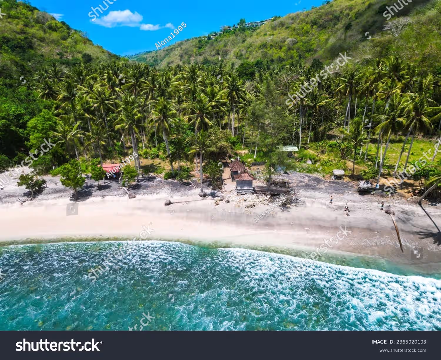 Gamat Bay beach and cliffs